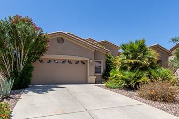 Saddlebrook house for rent - A house with a brown garage door and a driveway.