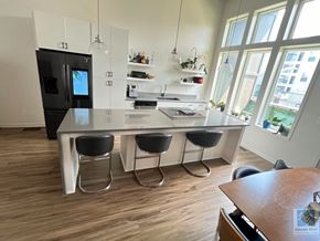 Atlanta house for rent - a kitchen with a large island with four stools