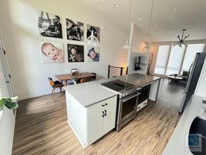 Atlanta house for rent - a kitchen and living room with a stove and a counter top