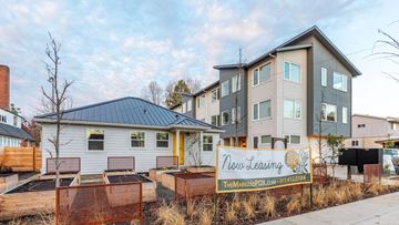 Portland apartment for rent - a row of houses with a sign in front of them