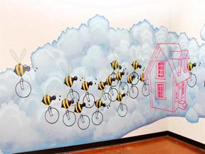 Richmond apartment for rent - a mural of bees flying over a house and a building