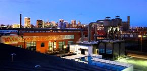 Richmond apartment for rent - a building with a pool and a city in the background