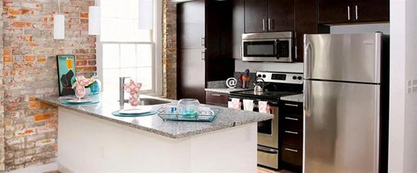 Richmond apartment for rent - a kitchen with a counter and a refrigerator
