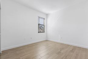 Estero house for rent - A room with wooden flooring and a window with blinds.
