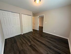 Rock Hill apartment for rent - A room with two white doors and a wooden floor.