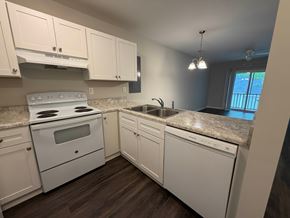 Rock Hill apartment for rent - A kitchen with white appliances and cabinets.