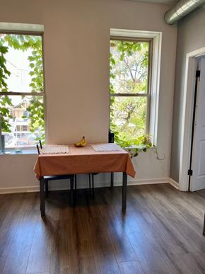 Chicago apartment for rent - A table with a tablecloth and a banana on it.