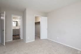 Montgomery apartment for rent - A white room with a carpeted floor and two open doors.