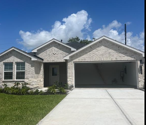 Rosenberg house for rent - a white brick house with a garage door