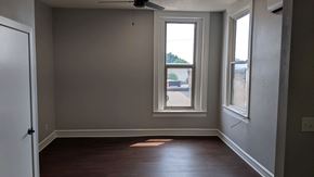 Sioux City apartment for rent - an empty room with a window and wooden floors