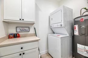 Glendale apartment for rent - a white kitchen with a refrigerator and a washer and dryer