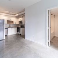 Victoria apartment for rent - A kitchen with white appliances and a white refrigerator.