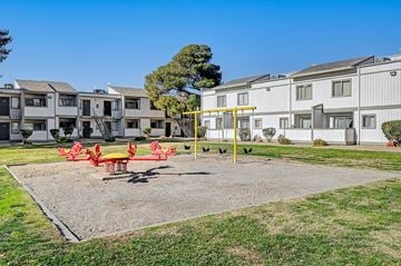 Las Vegas apartment for rent - a living room with rocking chairs and a ceiling fan