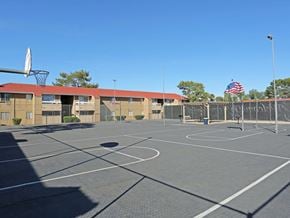 Las Vegas apartment for rent - an empty basketball court in a school parking lot