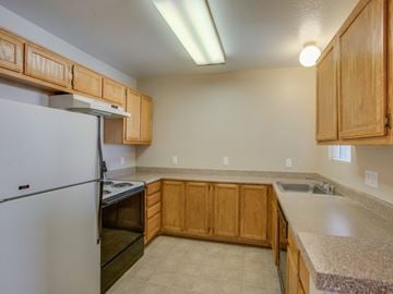 Las Vegas apartment for rent - a kitchen with a stove refrigerator and a sink