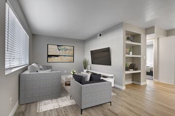 Las Vegas apartment for rent - the living room of an apartment with two couches and a tv