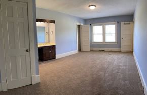 Benson house for rent - an empty living room with a sink and a window