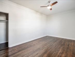 Hasbrouck Heights apartment for rent - A room with a ceiling fan and wooden flooring.