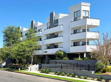 Los Angeles apartment for rent - A white modern building with black railings and balconies.
