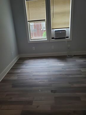 Washington apartment for rent - the living room has a hardwood floor and two windows