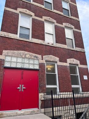 Chicago apartment for rent - A red door with the numbers 2013 on it.