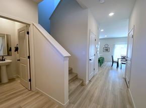 Merced house for rent - A hallway with a staircase leading to a bedroom.