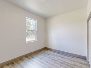 Ocklawaha house for rent - A room with a window and wooden flooring.