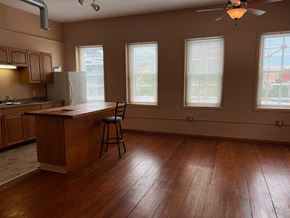Grinnell apartment for rent - an empty kitchen with wood floors and a counter top