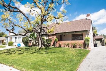 South Pasadena house for rent - the front of a house with a lawn and a tree