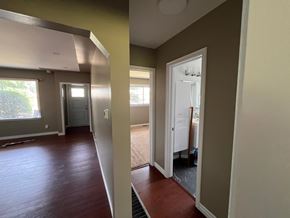 Kitchener apartment for rent - a view of a living room and a hallway with wood floors