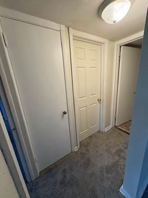 Cleveland apartment for rent - A white door is in a room with a carpet.