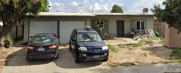 Santa Maria apartment for rent - Two cars are parked in front of a garage.