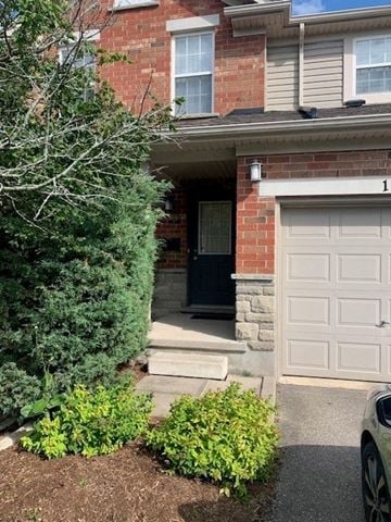 Guelph apartment for rent - a house with a white door and a white garage door