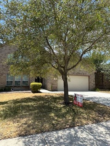 San Antonio house for rent - a house with a tree and a sign in the grass