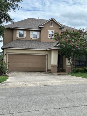 San Antonio house for rent - a house with a driveway and a garage door