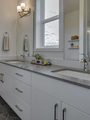 Edmonton apartment for rent - a large white kitchen with two sinks and a window