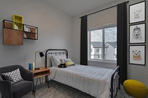 Edmonton apartment for rent - a bedroom with a bed and a window
