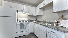 Colorado Springs apartment for rent - the living room of an apartment with a round table and a couch
