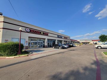 Dallas apartment for rent - a wash  dry store with cars parked in front of it