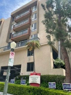 Los Angeles apartment for rent - a tall building with a tree in front of it