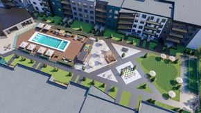 Saskatoon apartment for rent - an aerial view of an apartment complex with a swimming pool