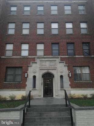 Washington apartment for rent - a large brick building with stairs in front of it