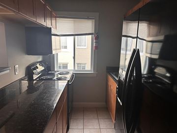 Washington apartment for rent - a kitchen with a stove and a window