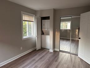 Washington apartment for rent - a bedroom with a closet and a door to a bathroom