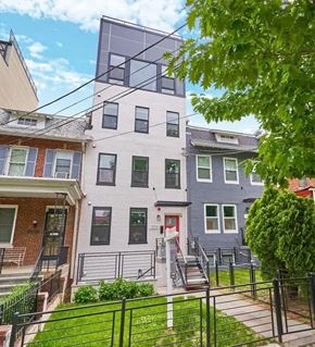Washington apartment for rent - a white building with a red door and