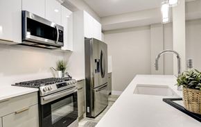 Washington apartment for rent - a kitchen with stainless steel appliances and a sink