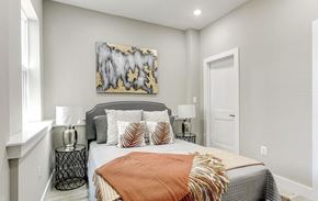Washington apartment for rent - a bedroom with a bed and a window