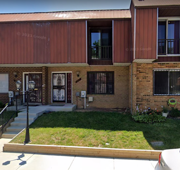 Washington apartment for rent - a brick building with a yard in front of it