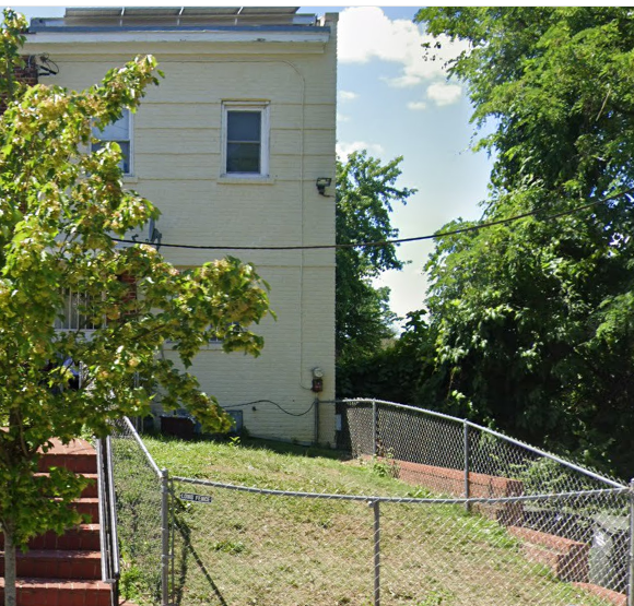 Washington apartment for rent - a white building with a fence in front of it