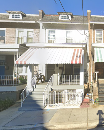Washington apartment for rent - a house with a white porch and a red and white awning